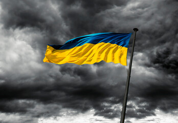 Flag of Ukraine against dramatic sky