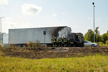 Fully burned truck on road