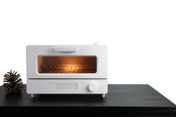 white modern design toaster oven is on the black wooden table with pinecone background of white wall of the kitchen (clipping path included)