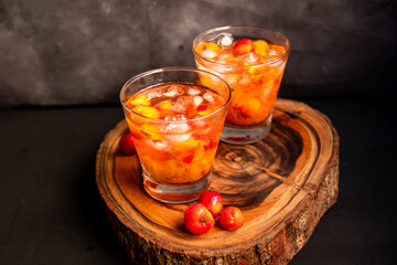 Brazilian Caipirinha, made with Acerola(Barbados Cherry) and cachaça, traditional drink from Brazil.  Copy space