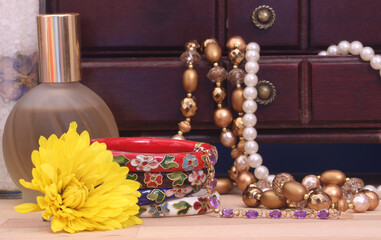 Perfume and Jewelry With Flower and Jewelry Box close up