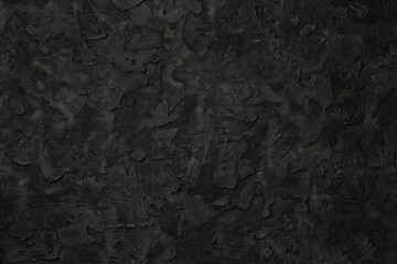 Black stucco texture. Black stone background. Copy space for text. Flat lay.