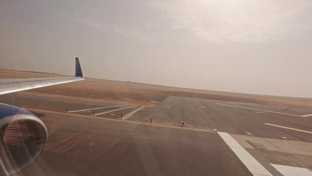 Airplane takeoff at Hurghada airport, view from the porthole. Aircraft preparation for flight. Jet maintenance: Egypt, Hurghada - 9 December, 2021