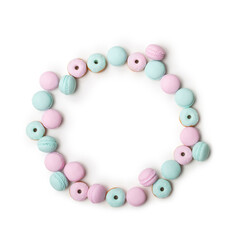Donuts and macaroons made of polymer clay isolated on white background. Top view with copy space