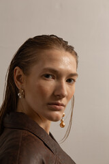 Fashion portraits of a stylish and tall model with makeup and hair