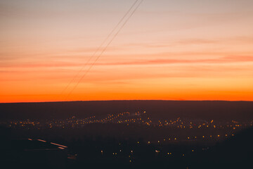 Art landscape with a view of the city and sunset. With film, grain and blur effects