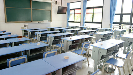 Fototapeta na wymiar Empty classroom with chairs, desks..