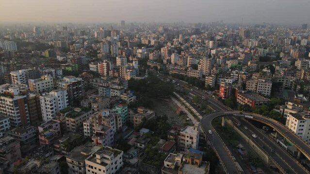 Large train traveling through Dhaka metropolis, Indian city in Bangladesh