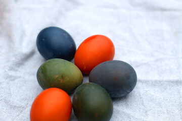 Colorful Easter eggs on neutral fabric. Selective focus.