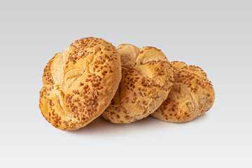 Kaiser roll with sesame seeds, on a light background