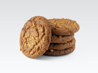 Oatmeal cookies with peanuts and oatmeal, on a light background