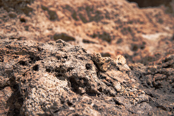 Stone mountains and cliffs. Close-up rocks by the sea. Natural background.