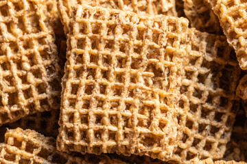 Healthy bite size whole wheat breakfast cereal biscuits high in dietary fiber.