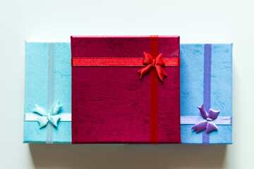 Stack of colorful gift box on table.