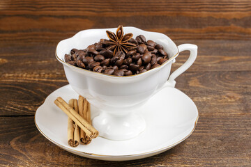 cup of coffee and anise on a wooden background
