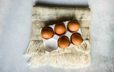 Overhead view of eggs in a ceramic egg carton