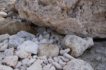 Stone mountains and cliffs. Close-up rocks by the sea. Natural background.
