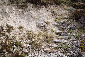 Stone mountains. Geological research near the sea. Natural background. Summer landscape.
