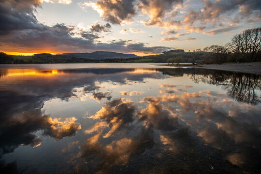 Reflections of clouds in Lake Bala at sunset, Gwynedd, Wales, UK