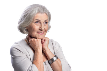 Happy senior woman wearing light dress posing on white background