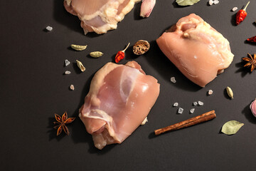 Raw chicken thigh without bones or skin. A useful ingredient for preparing healthy food, spices