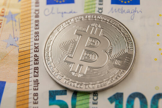 bitcoin on euro banknotes close-up