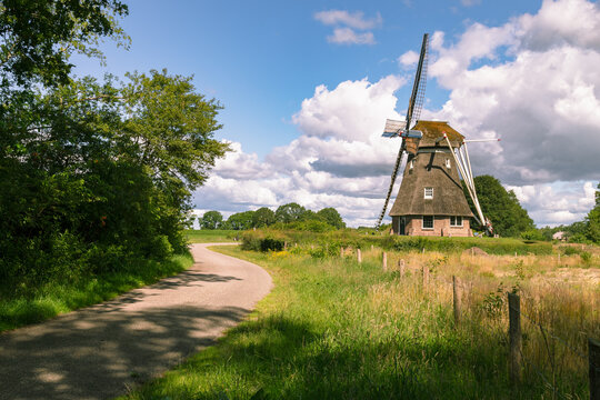 Dutch thatched, octagonal wooden windmill in the village of Ruinen in the province of Drenthe