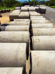 Rows of big concrete pipes in a factory at the side of the road near the town of Miniquira, in the...