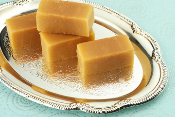 Mysore pak, a traditional, popular, and delicious sweet dish native to the city of Mysore,...