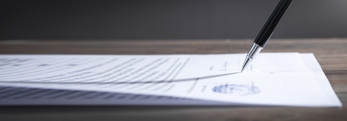 Pen signing in contract. Business
