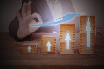 Businessman hand arranging wood cube stacking as step stair. Business growth, progress or success...