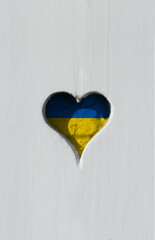 Support and solidarity for Ukraine. Concept with a heart with colours of the Ukrainian flag. Stand with the resistance. 