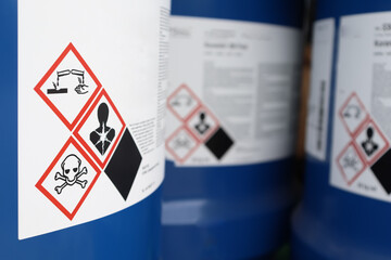chemical bottles with hazard labels shown