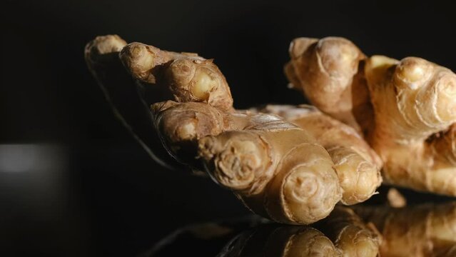 Whole ginger root on close up rotating.a composition based on ginger, fresh and spicy food that is good for the body, and an additional taste to food or drink. Concept: health, diet, health, nutrition