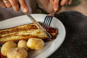 Tasty fried fish and sea fruits with potato traditional Canarias dish.