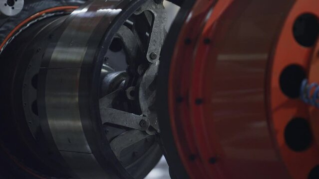 Detailed automobile tyre plant mechanism moving in automotive workhouse closeup