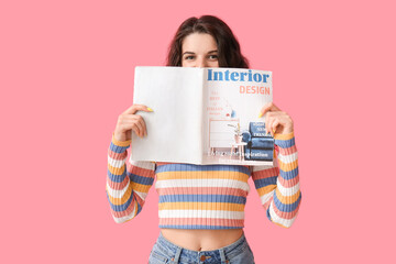 Beautiful brunette woman with magazine on pink background