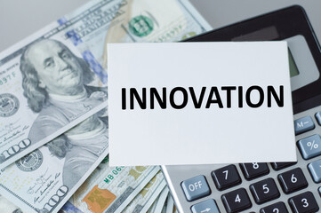 Innovation text on the card next to the calculator and paper bills