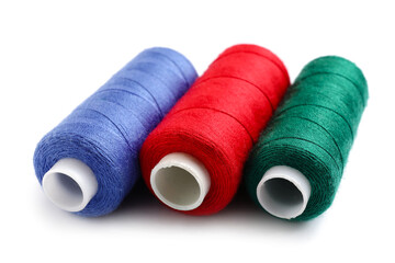 Beautiful sewing threads on white background