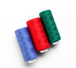 Beautiful sewing threads on white background