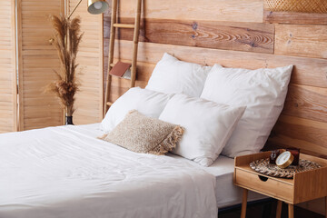 Fototapeta na wymiar Interior of modern bedroom with wooden wall