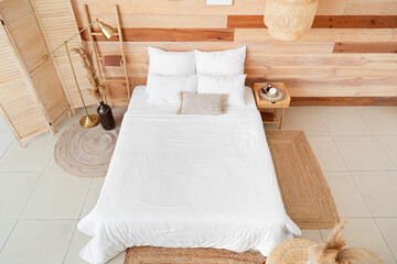 Fototapeta na wymiar Interior of modern bedroom with wooden wall