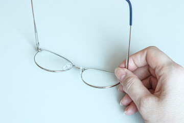 Glasses in female hands, copy space template, banner.