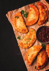 Fried mini pasties, with red sauce, top view, close-up, no people, selective focus,