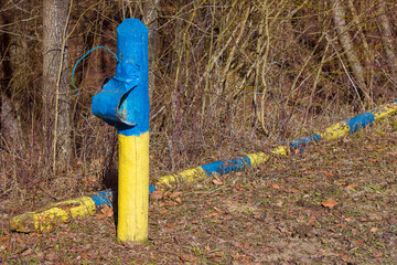 Border post of independent Ukraine in national yellow-blue colors, the concept of attack and war in Ukraine, defending their territories