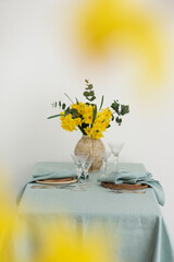 Concept of romanitic Easter table with flowers