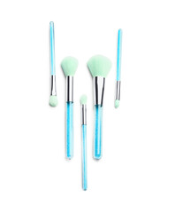 Beautiful makeup brushes on white background