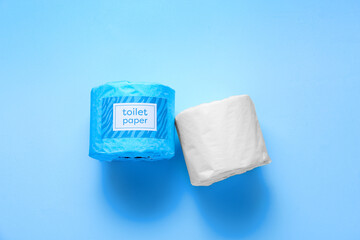 Toilet paper rolls on blue background
