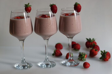 Strawberry banana milk shake. Shot on white background