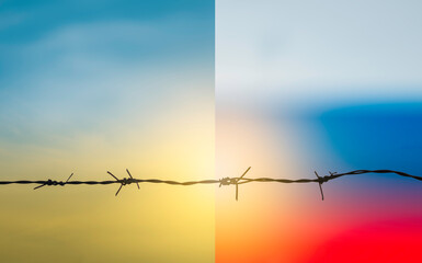 Barbed wire fence with sunset Twilight sky. Chain spike for world war safe security boundary...